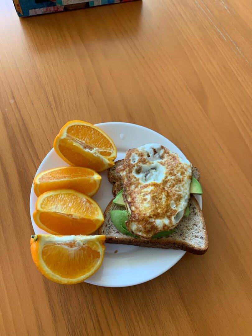 photo of whole grain bread as well as some avocado