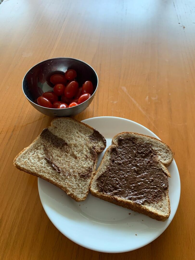 two pieces of toast with a chocolate hazelnut spread